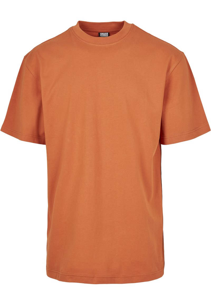 Korte mouwen T-shirt in een levendige branderige oranje kleur. Gemaakt van zachte stof met een ronde hals en een relaxte pasvorm. Geen zichtbare patronen of grafische elementen.