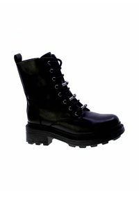 Bottines en cuir noir avec une semelle épaisse, des œillets en métal argenté et des lacets. Équipées d'une languette et d'une semelle à crampons robuste.