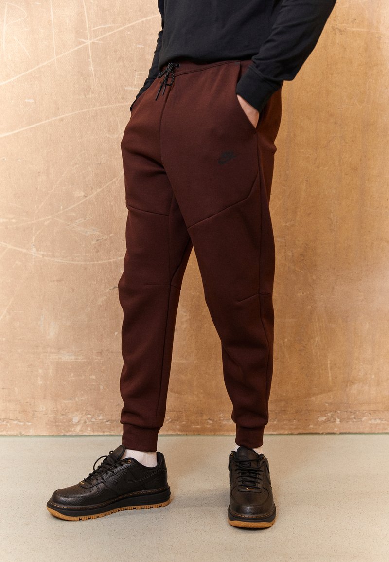 Nike Sportswear Tracksuit bottoms brown/black/brown Zalando.ie