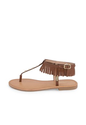 Brown leather sandal with fringe detailing, flat sole, ankle strap with a buckle, and a simple toe post design, featuring a tan insole.