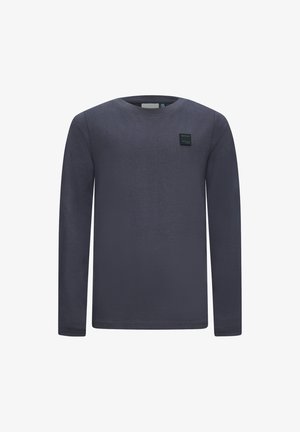 Camicia a maniche lunghe in cotone blu scuro, con scollatura rotonda e una piccola etichetta nera "RETOUR" sul petto.