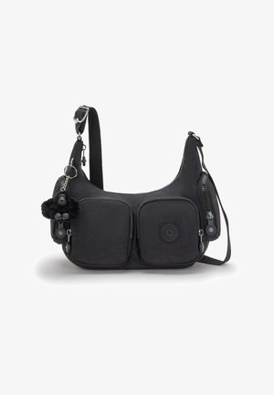 Black shoulder bag made of durable fabric; features two front zip pockets, logo detail, and a furry keychain attached. Adjustable strap.