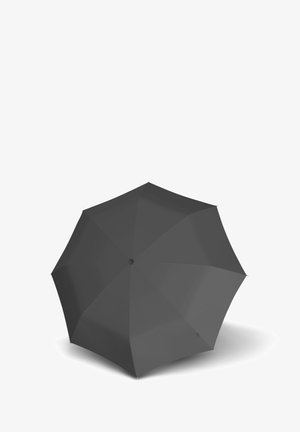 Closed black umbrella shown from above with eight panels and central button on white background.