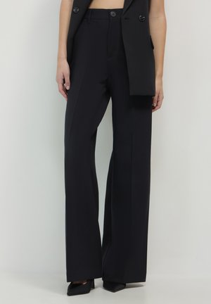 Black wide-leg trousers made of smooth fabric, featuring a high waist and clean lines, with front pleats and no visible patterns.