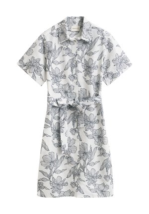 Witte korte mouw jurk met zwart bloemencontourpatroon en bijpassende stoffen riem gestrikt in de taille.