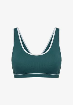 Donkergroene sportbeha met witte rand langs de banden en onderkant, met een ronde halslijn en brede schouderbanden.