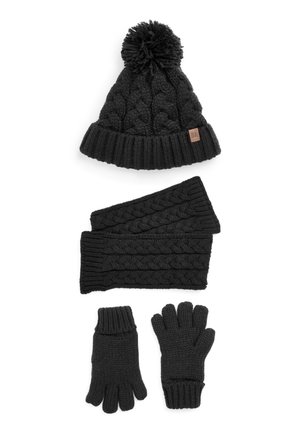 Schwarze Strickmütze mit Bommel, passender strukturierten Schal und Handschuhe. Sie hat ein geflochtenes Muster und gerippte Ränder und besteht aus weichem Garn.