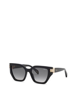 Schwarze Cat-Eye-Sonnenbrille mit Verlaufsgläsern, goldenen Akzenten und kleinen dekorativen Gold- und Kristallverzierungen an den Bügeln.