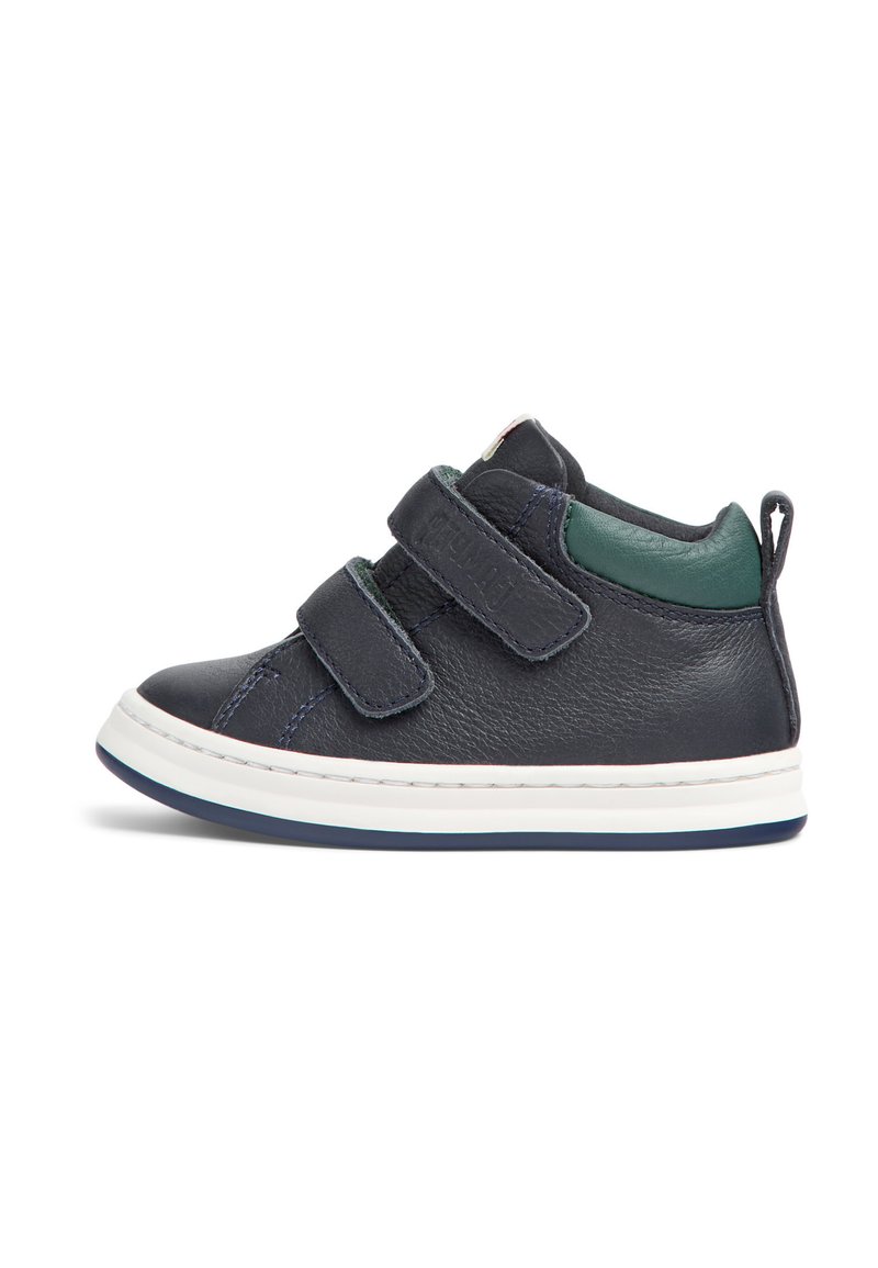 Navy leather shoe with green accents, two Velcro straps, white outsole, and a loop at the back for easy wear. Rounded toe design.