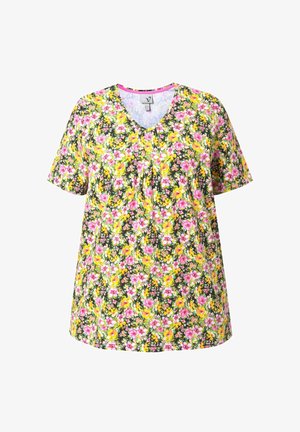 Chemise à manches courtes et col en V avec un motif floral coloré comprenant des fleurs roses, jaunes et blanches sur un fond vert foncé.