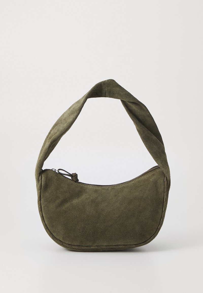 Olive green suede shoulder bag with a curved shape, braided accents along the seam, and a zippered top closure. Soft texture.