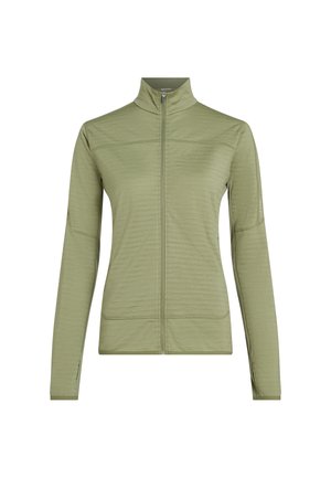 Vaaleanoliivinvihreä, pitkähihaisen vetoketjullinen takki, jossa korkea kaulus, kapea istuvuus ja hienovaraiset ompelut yksityiskohdat valkoisella taustalla.