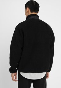 Carhartt WIP Fleecejakke - black