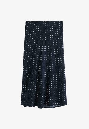 Marineblå knælang nederdel lavet af stof med hvide polkaprikker. Har elastisk taljebånd og en flydende A-formet silhuet.