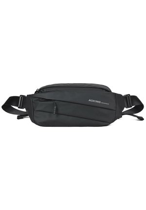 Black fanny pack made of durable nylon. Features a sleek design, textured accents, and a front zipper pocket for storage. Adjustable strap.