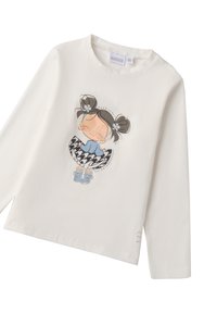 Langärmliges cremefarbenes Baumwoll-T-Shirt mit einer verspielten Mädchenillustration, verziert mit Akzenten und einem Hahnentrittmuster-Rockdesign.