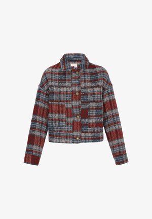 Lühendatud, mitmevärviline bleiser, millel on ruuduline muster punase, sinise ja halli varjundiga. Ees on viis nuppu ja kraega kaelus.