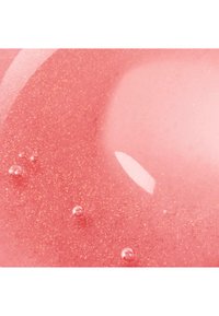 Glossy pink liquid with gold shimmer and small bubbles, creating a smooth and reflective surface texture.