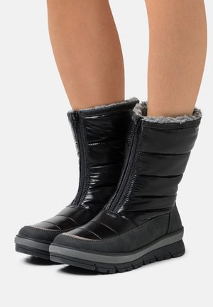Black waterproof boots with a padded design, zip closure, and gray fleece lining. Features a textured gray rubber sole for traction.
