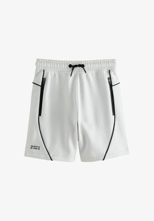 Hellgraue Sportshorts mit schwarzem Kordelzug, seitlichen Reißverschlusstaschen in Schwarz, schwarzer Paspelierung und bedruckten Koordinaten am Saum des linken Beins.