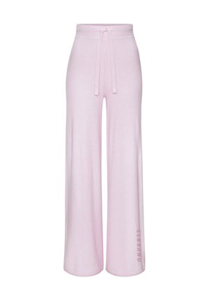 Light pink wide-leg pants with a drawstring waist and small vertical logo text near the hem on the left leg.
