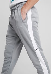 Nike Sportswear Träningsbyxor - dark grey