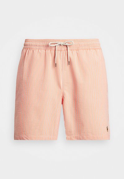 Svītrainie peldbikši oranžā un baltā krāsā, ar elastīgu jostasvietu, auklas aizdari un sānu logotipa detaļu. Viegls audums.