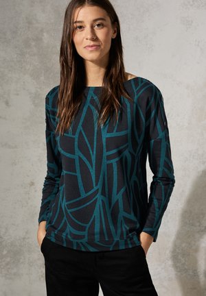 Long-sleeve top in dark blue with a teal abstract pattern, made of soft fabric, featuring a boat neckline and relaxed fit.