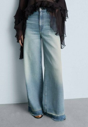 Wide-leg denim jeans in light blue with a faded finish, featuring raw hem edges and a high waist design.