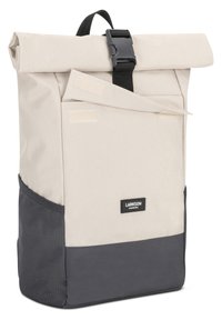 Rolled-top backpack in beige and dark gray. Made of durable fabric, features a buckle closure, and has a front pocket with Velcro.