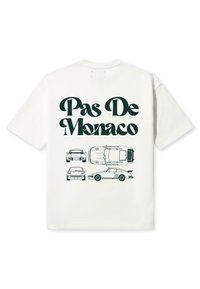 Camiseta blanca de algodón con el texto "Pas De Monaco" en verde oscuro, con ilustraciones en contorno de varios coches debajo.