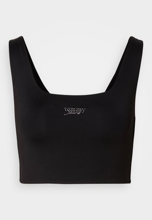 Top corto nero con scollo quadrato, realizzato in tessuto liscio. Presenta un piccolo logo ricamato in argento "tommy" sul davanti.
