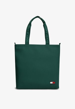 Ciemnozielona prostokątna torba na ramię z dwoma paskami oznaczonymi "Tommy Jeans" oraz małą naszywką z logo Tommy Jeans w dolnym rogu.
