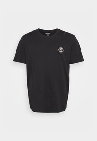 Black cotton T-shirt with a round neckline. Features a small white sun and eye graphic on the left chest. Short sleeves, regular fit.