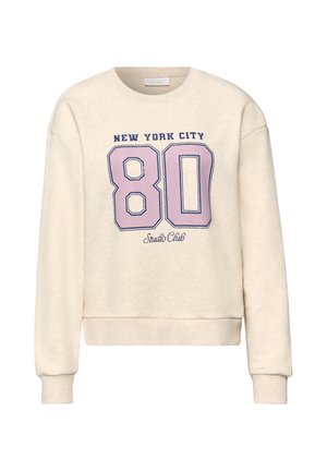 Beige sweatshirt med lange ærmer, med teksten "New York City" over et stort lyserødt "80" og "Studio Club" nedenfor på forsiden.
