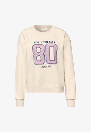 Beżowa bluza z długim rękawem, na froncie z napisem "New York City" nad dużą różową liczbą "80" oraz napisem "Studio Club" poniżej.