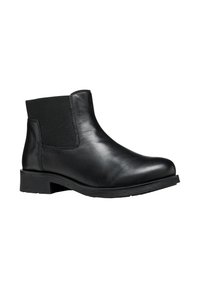 Bottine en cuir noir avec panneaux latéraux élastiques, bout rond et petit talon block. Texture lisse, design minimal et sans matériel visible.
