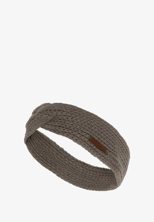Vlechtgeweven haarband in gedempt grijs, met een gestructureerd patroon en een klein brown leren label. Zachte, rekbare stofontwerp.