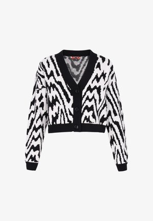 Cárdigan recortado en blanco y negro con un patrón de zigzag, escote en V, mangas largas y cierre de botones, con puños y dobladillo de canalé.