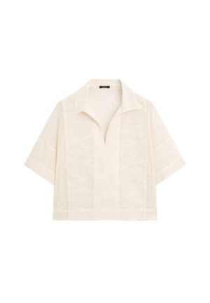 Chemise en maille texturée crème à manches courtes, col ouvert et ourlet droit.