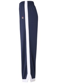 Pantaloni da jogging navy con strisce laterali bianche, realizzati in tessuto morbido. Presentano un design a righe sottili e una vita elastica con dettaglio del logo.