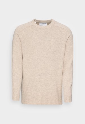 Light beige knitted sweater with a crew neck, long sleeves, and ribbed cuffs; features a textured fabric and simple design.