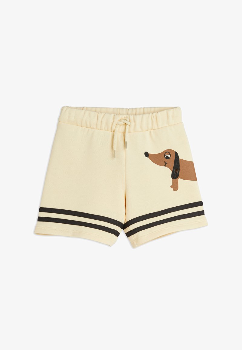 Cream-colored shorts with an elastic waistband, featuring a brown dachshund graphic and black striped accents near the hem.
