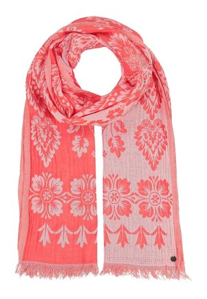 Light coral pink scarf with white floral and leaf patterns, lightweight fabric, and fringed edges, arranged in a loop shape.