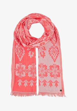 Light coral pink scarf with white floral and leaf patterns, lightweight fabric, and fringed edges, arranged in a loop shape.