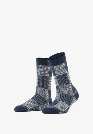 Marineblaue und graue gemusterte Socken mit geripptem Bündchen, strukturiertem Strick und kariertem Design mit kontrastierenden Quadraten.