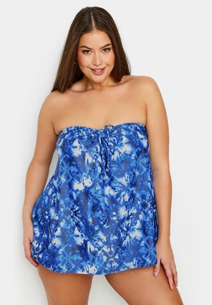 Robe de plage sans manches en tie-dye bleu avec un détail à cordon au niveau du col. Tissu léger et fluide avec une coupe ample et décontractée.