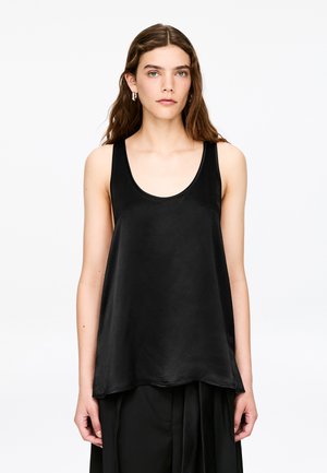 Black sleeveless top made of satin with a smooth texture, featuring a scoop neckline and a loose, flowing silhouette.