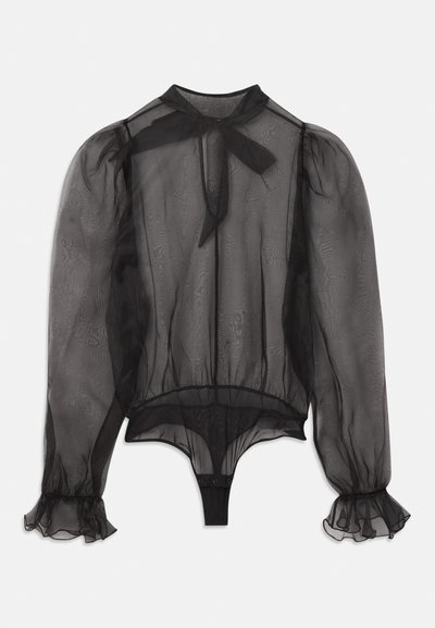 Must mustrinna musta särk kõrge kaelusega, punnis varrukatega ja volangkäistega. Omab sidumisdetaili kaelas ja bodysuit allaosa.