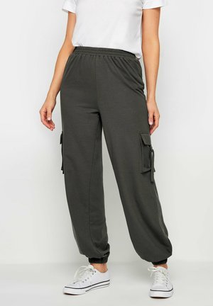 Cargo joggers van donkergrijze stof met een elastische tailleband en geribde manchetten; voorzien van zijzakken met kleppen en decoratieve koorden.